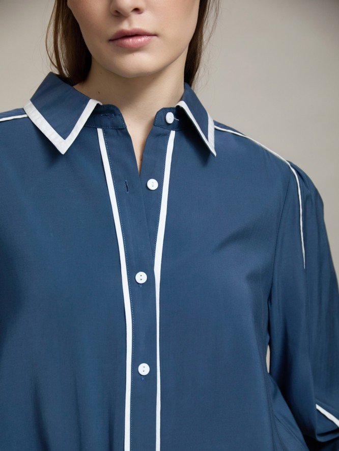Camisa elegante con vivos a contraste